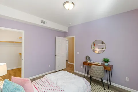 a bathroom with a double vanity sink mirror and shower