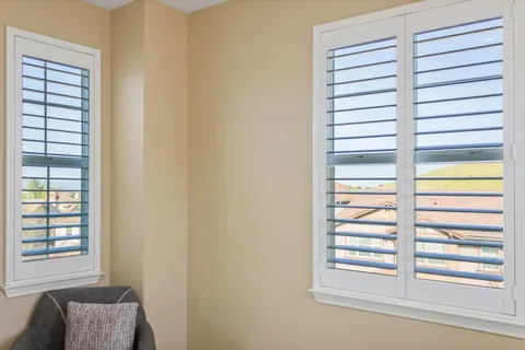 a bathroom with a sink a mirror and vanity