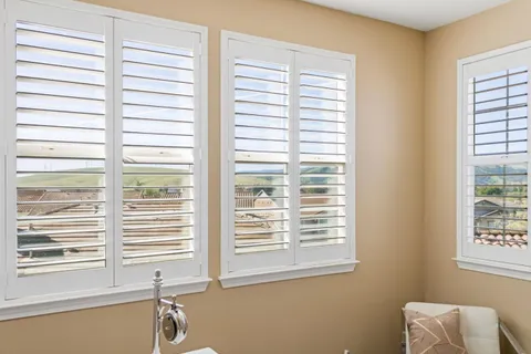 a view of washer and dryer with kitchen in the background