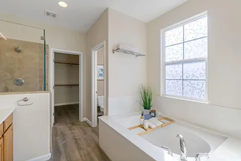 a view of an empty room with a ceiling fan