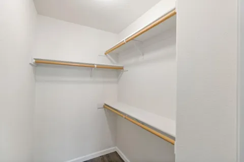 a view of a patio with table and chairs with wooden fence