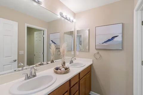 a view of a patio with couches table and chairs and potted plants