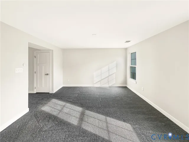 an empty room with a natural light