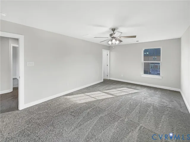 a view of empty room with fan