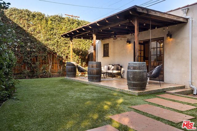 a patio with yard table and chairs