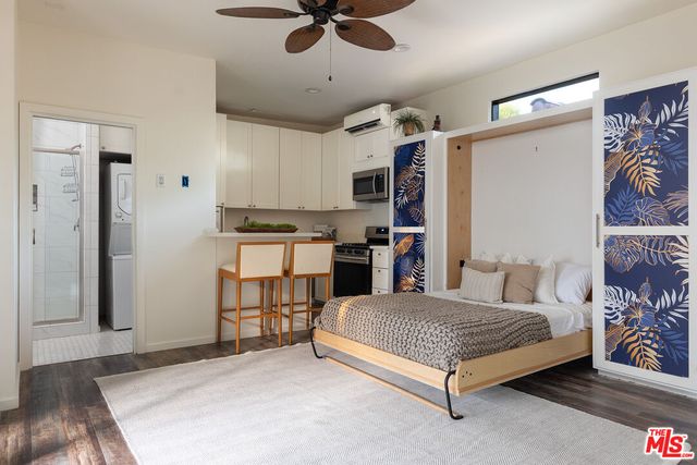 a kitchen with a stove a sink and a refrigerator