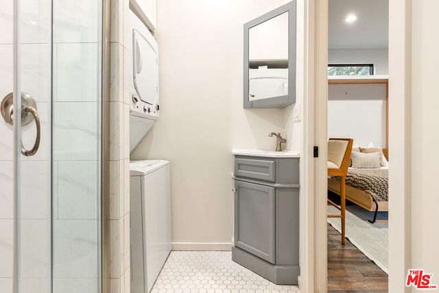 a backyard of a house with table and chairs