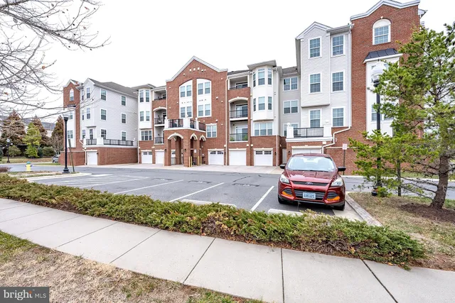 a view of a kitchen with a sink and wooden floor