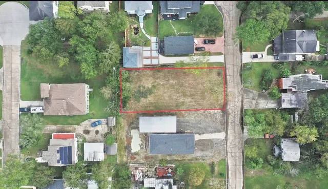 an aerial view of a house with outdoor space
