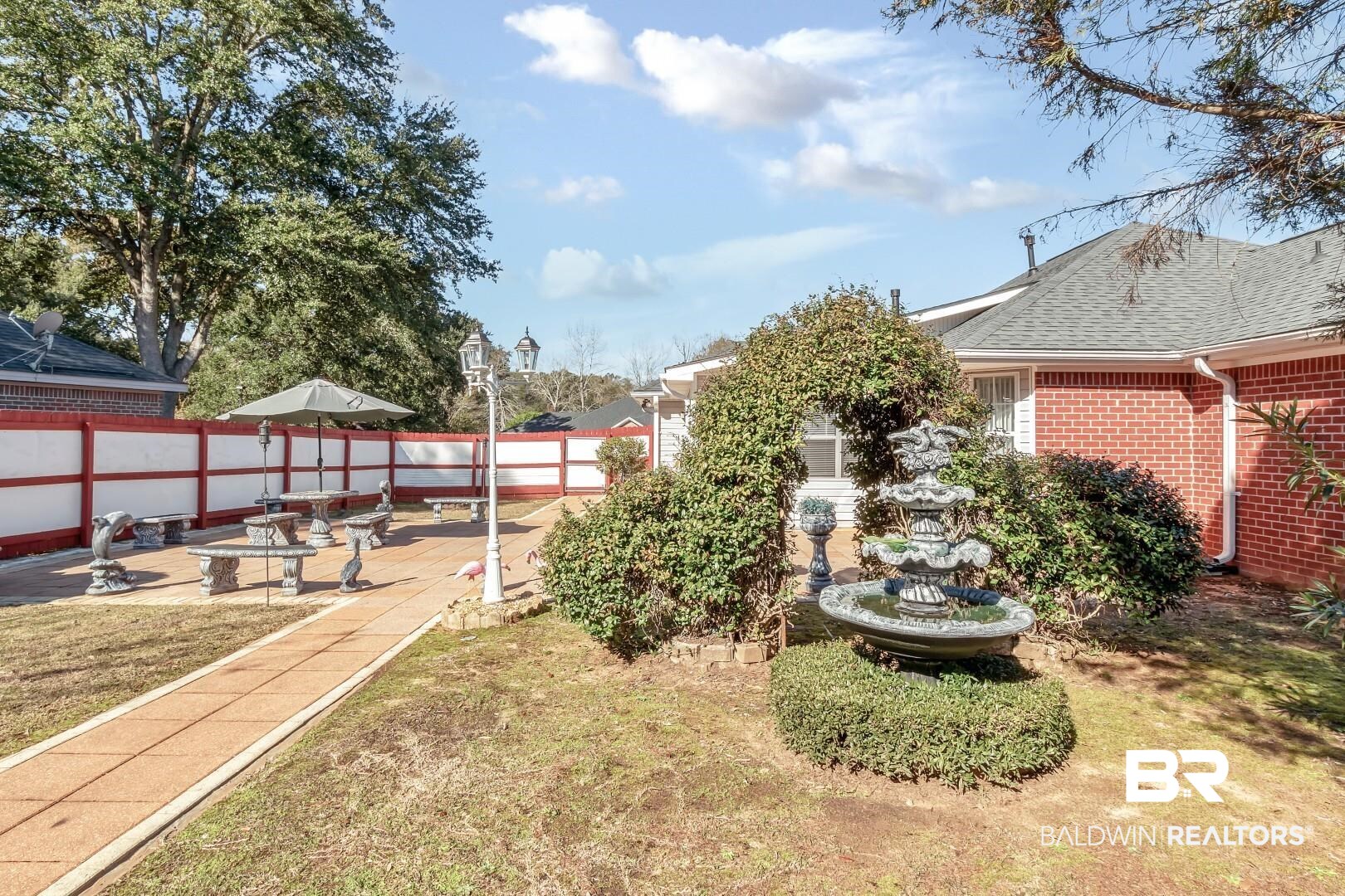 8221 Woodbend Drive Semmes, AL 36575 - Photo 33 of 35 View of yard with a patio