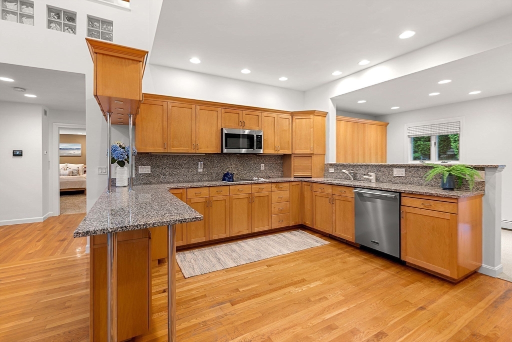 53 Gerald Road Marblehead, MA 01945 - Photo 6 of 42 a kitchen with stainless steel appliances granite countertop wooden cabinets a sink and dishwasher