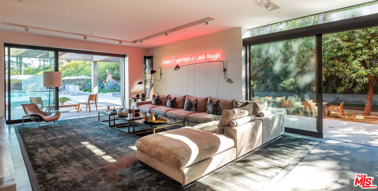 3350 Stoneridge Lane Los Angeles, CA 90077 - Photo 11 of 42 a living room with furniture and a large window