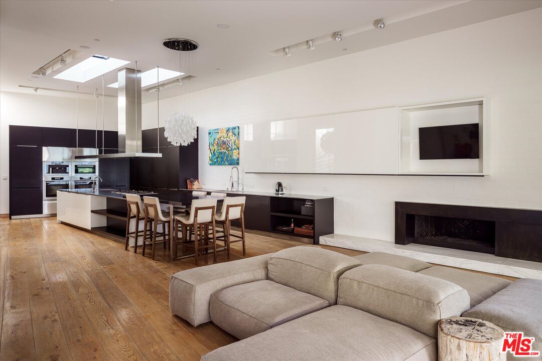 3350 Stoneridge Lane Los Angeles, CA 90077 - Photo 15 of 42 a living room with furniture and a flat screen tv