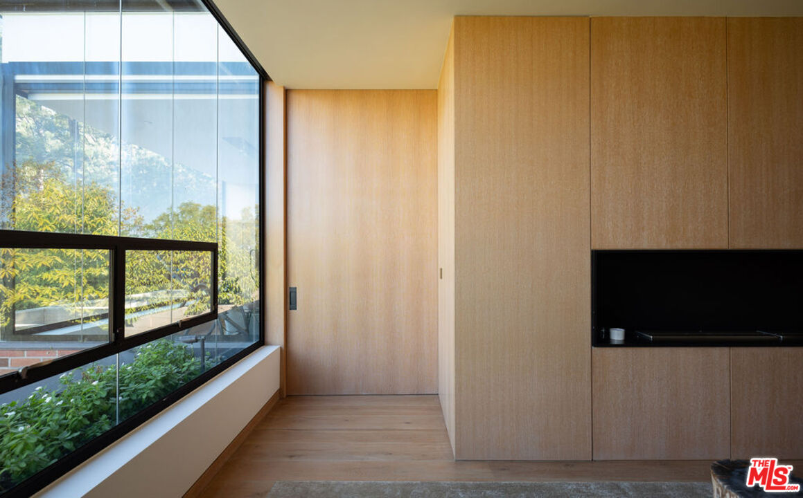 3350 Stoneridge Lane Los Angeles, CA 90077 - Photo 19 of 42 a view of a glass door and the balcony