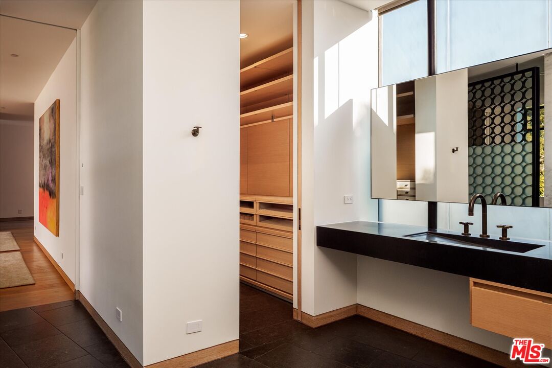 3350 Stoneridge Lane Los Angeles, CA 90077 - Photo 20 of 42 a bathroom with a sink and a mirror