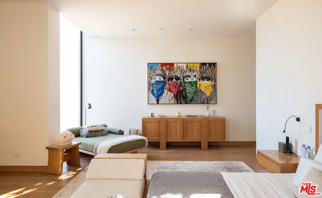 a living room with stainless steel appliances kitchen island granite countertop furniture and a rug