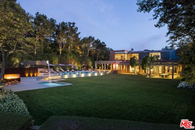 a view of a park with big trees