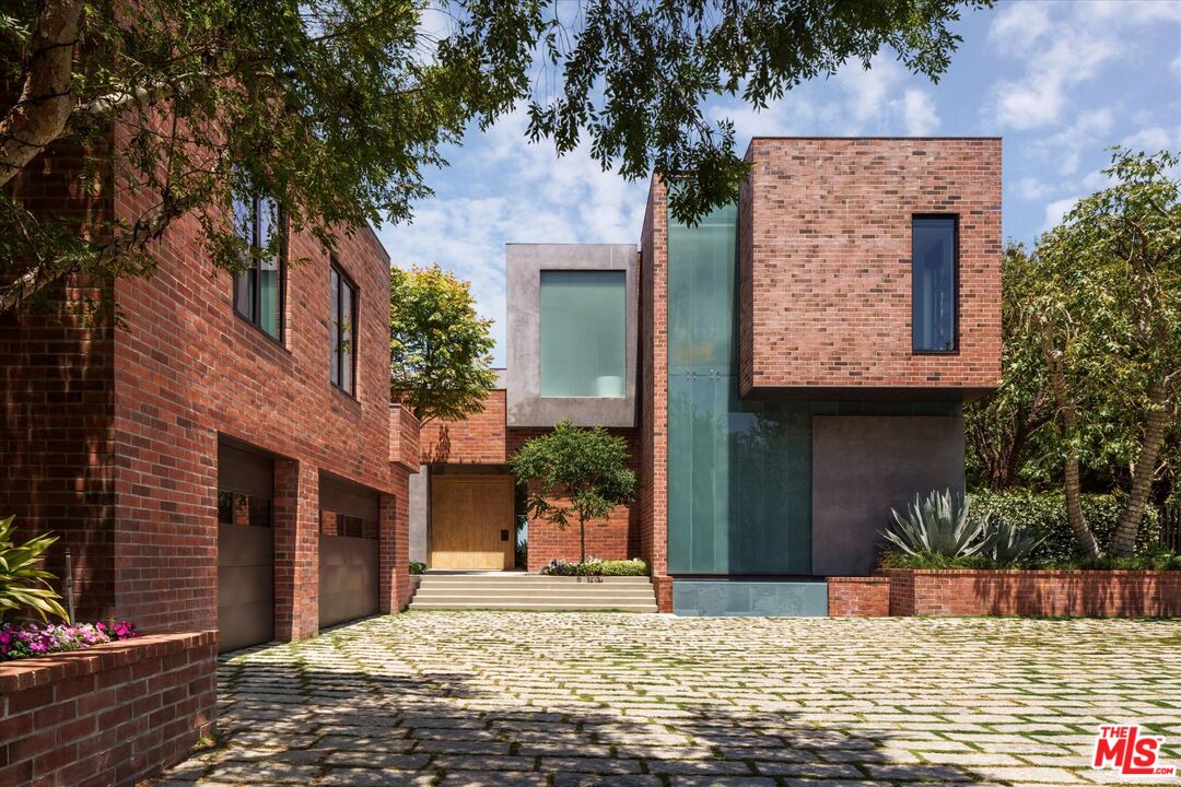 3350 Stoneridge Lane Los Angeles, CA 90077 - Photo 32 of 42 a front view of a house with a yard