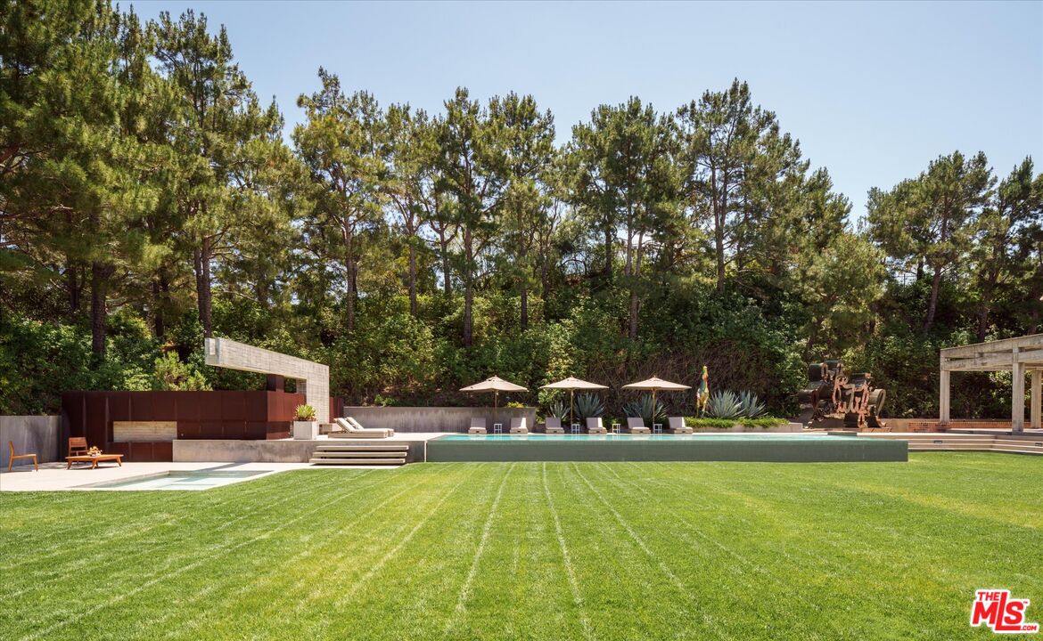 3350 Stoneridge Lane Los Angeles, CA 90077 - Photo 35 of 42 a front view of a house with garden
