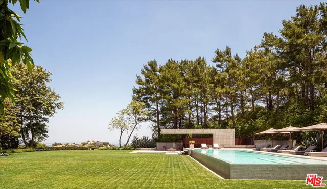 a view of a swimming pool with an outdoor space