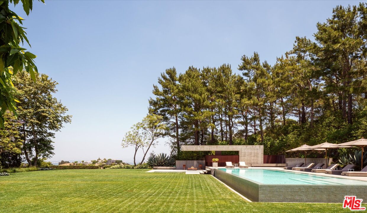 3350 Stoneridge Lane Los Angeles, CA 90077 - Photo 36 of 42 a view of a swimming pool with an outdoor space