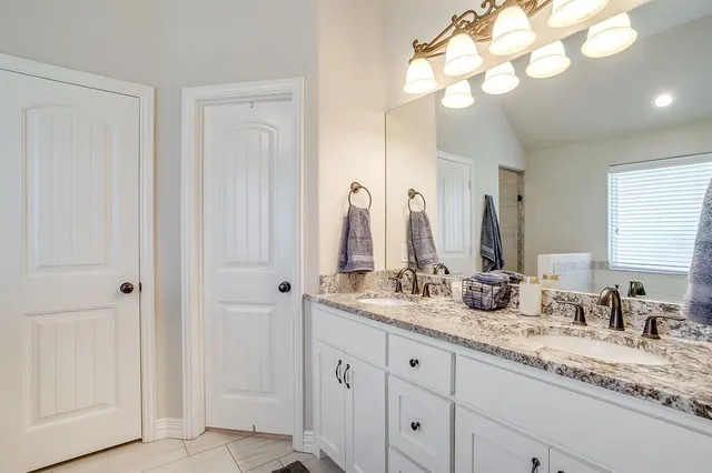 a bath tub sitting in a bathroom next to a window