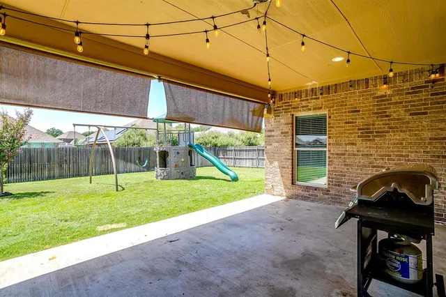 a view of a backyard with a slide