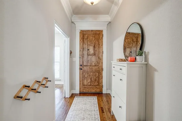 a view of a dining room with furniture and a window
