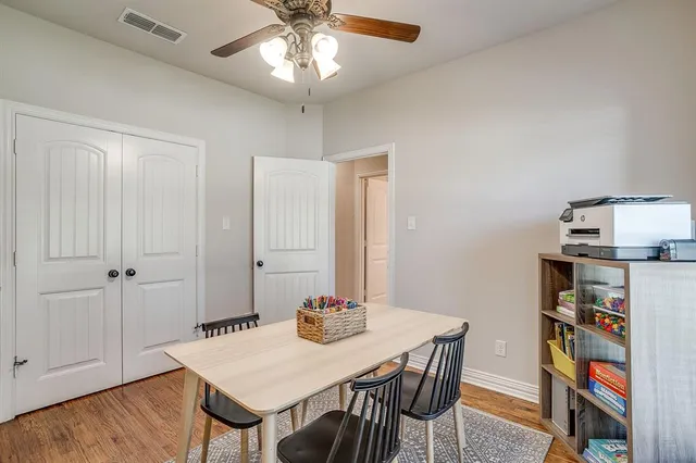 a living room with kitchen island furniture and a flat screen tv