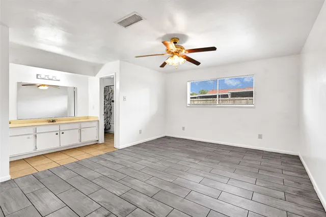 a view of a bedroom with a bed and a chandelier