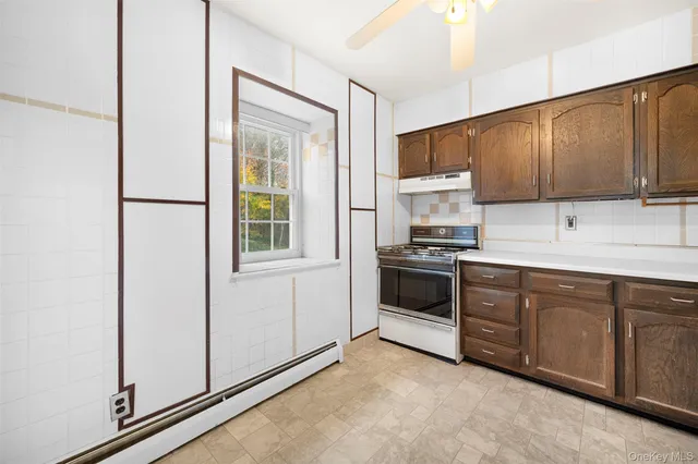a kitchen with a stove and a sink