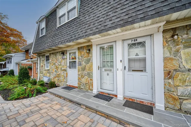 a view of a brick house with a large windows