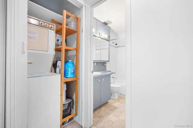 a hallway with washer and dryer