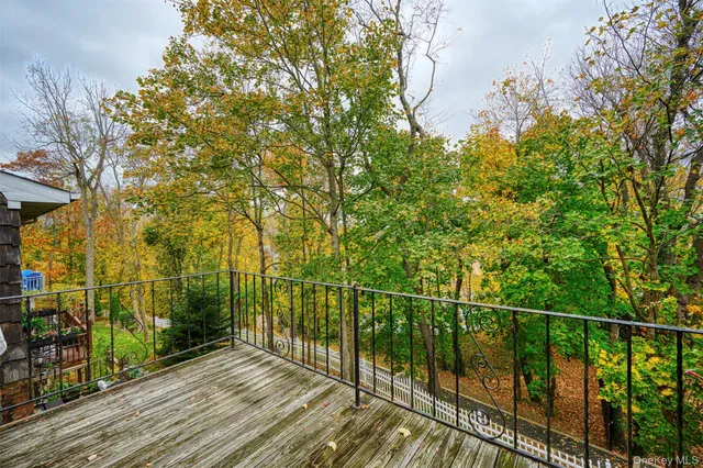 a view of a balcony with tree