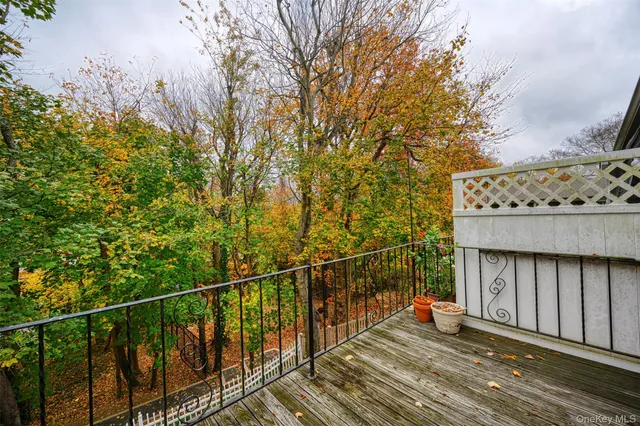 a balcony with wooden floor
