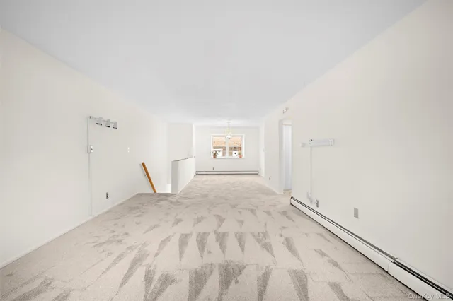 a view of empty room with a door