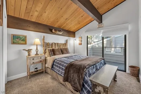 a bedroom with a bed and a table
