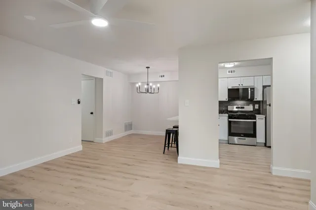a view of kitchen with microwave and furniture