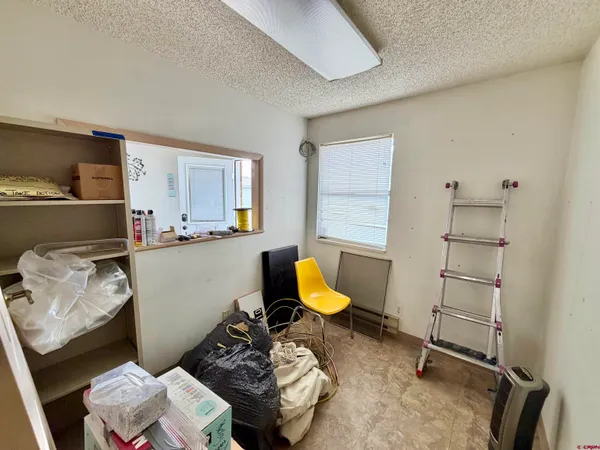 a room with furniture and a large window