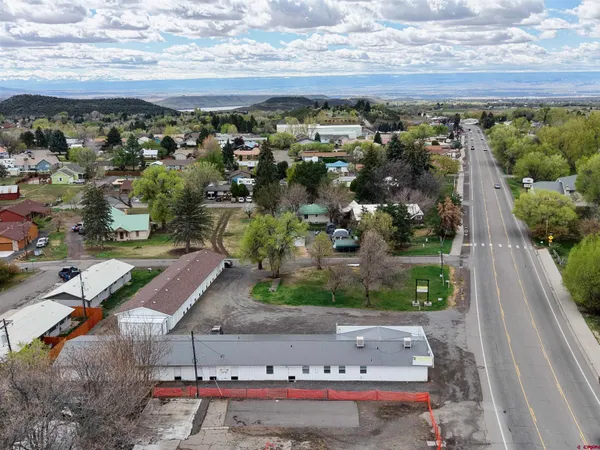 an aerial view of a residential houses with outdoor space