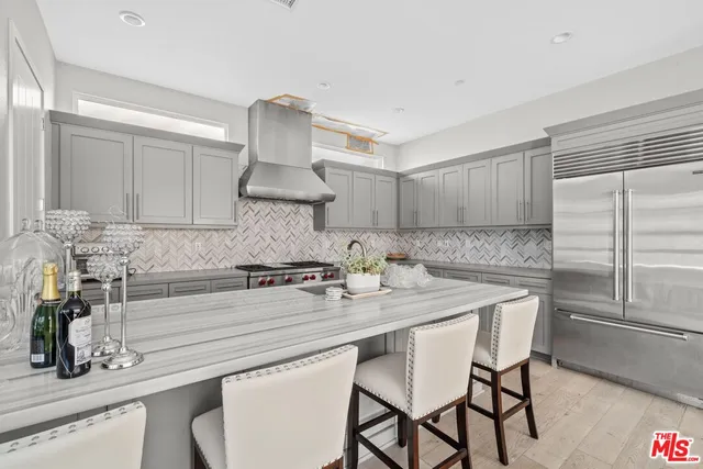 a kitchen with a sink cabinets and window