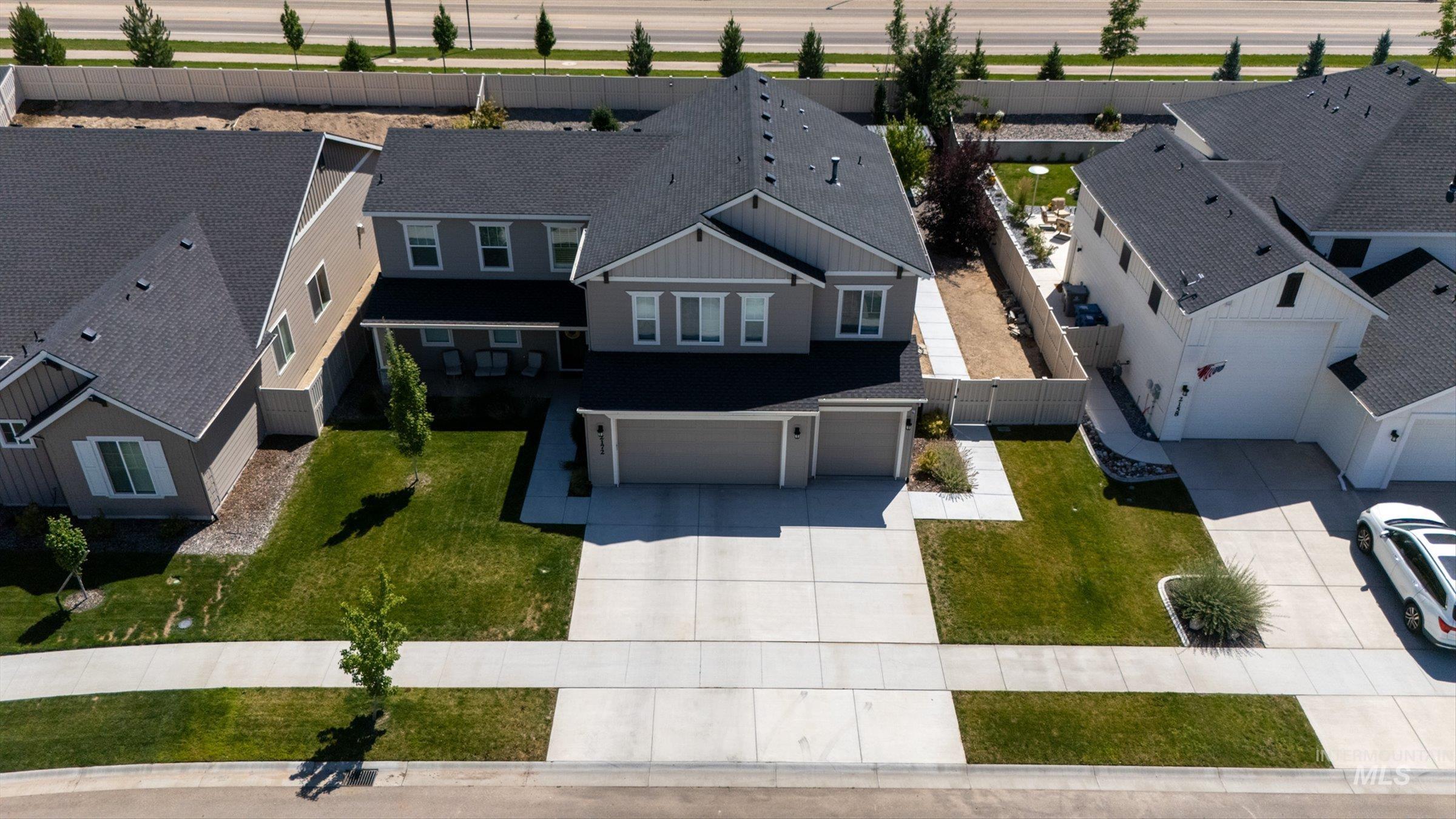 2172 Savoy Court Middleton, ID 83644 - Photo 37 of 46 Two-story residence featuring a two-car garage, concrete driveway, and front lawn