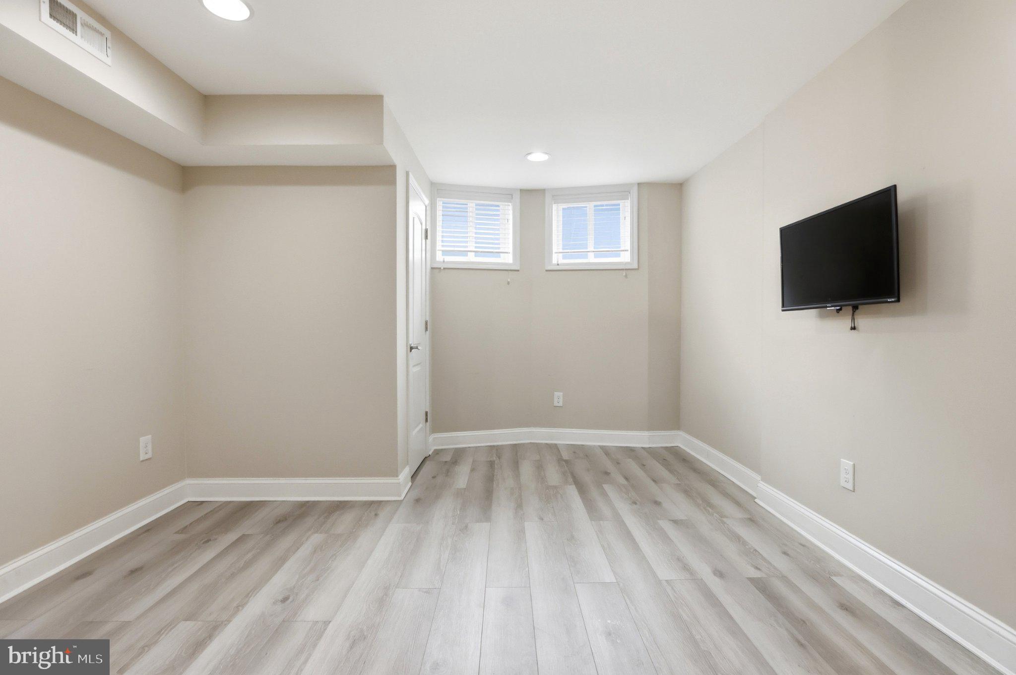 222 South Exeter Street Baltimore, MD 21202 - Photo 25 of 41 a view of a livingroom with an empty space and a window