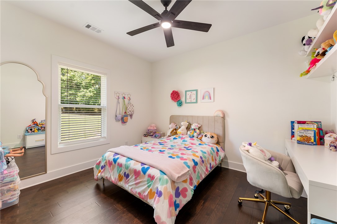 502 Canebrake Drive Anderson, SC 29621 - Photo 31 of 39 This cheerful bedroom offers comfortable living with rich wood floors and a bright window.