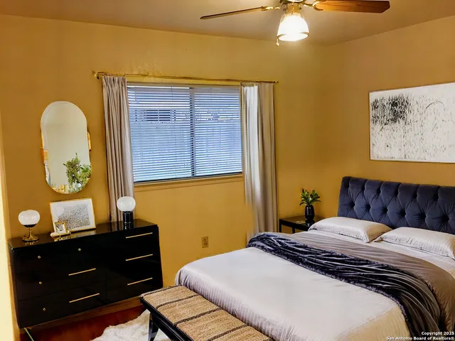 a bedroom with a bed and a dresser