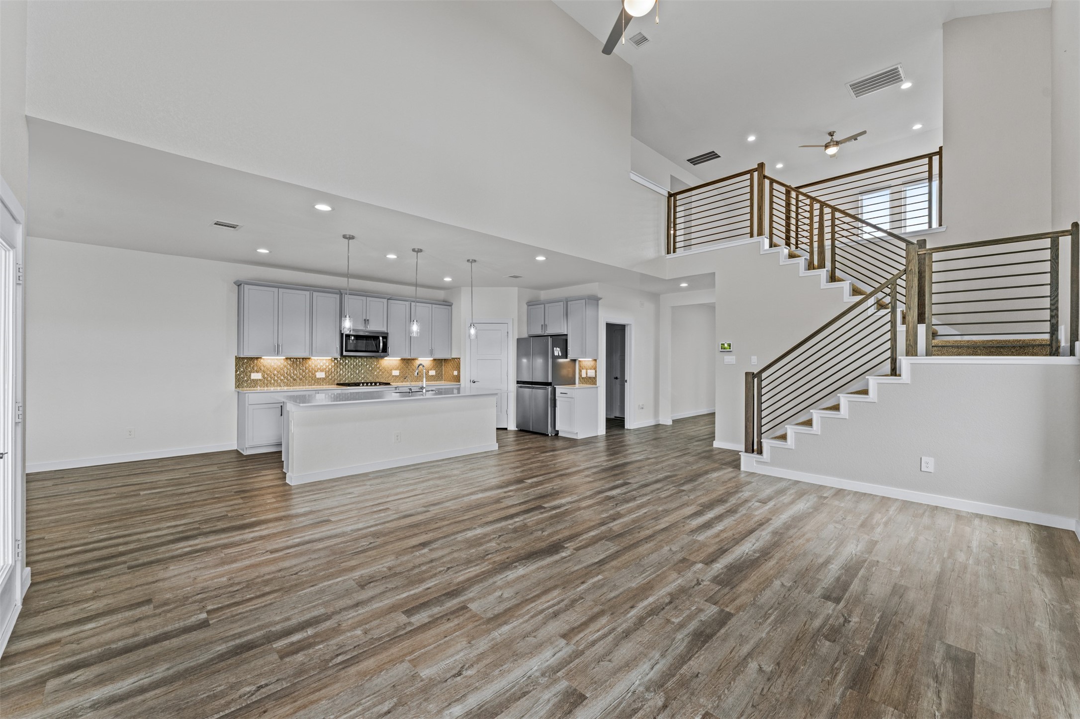 22503 Modica Rift Lane Katy, TX 77449 - Photo 8 of 47 a view of kitchen with cabinets and wooden floor