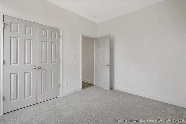a bathroom with a sink a toilet and a window