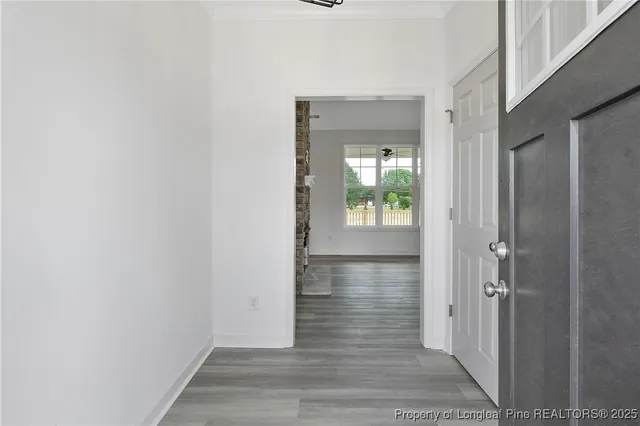 a view of hallway with wooden floor