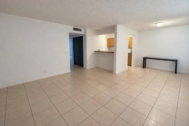 a bathroom with a sink a toilet a mirror and shower curtain