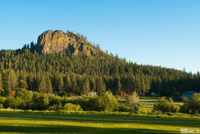 a living room with furniture a window and a table